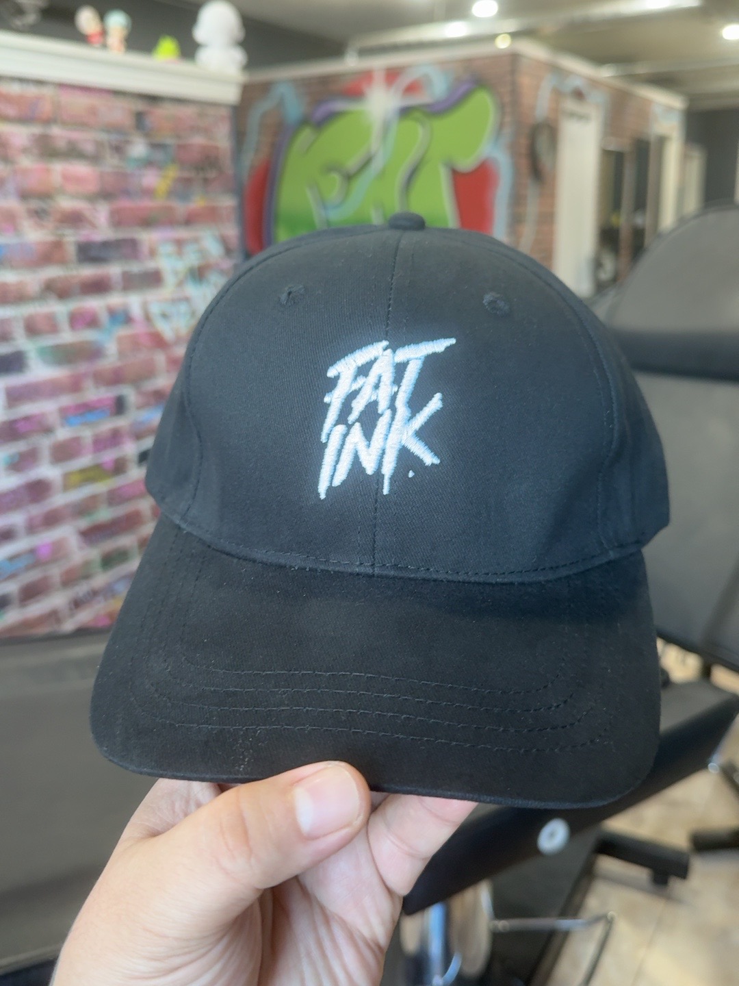 Black Fat Ink dad hat with white embroidered logo